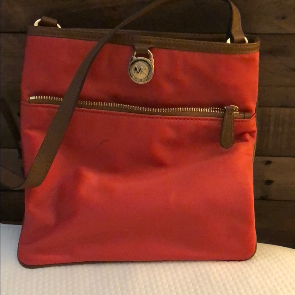 Water proof Michael kors crossbody bag never used